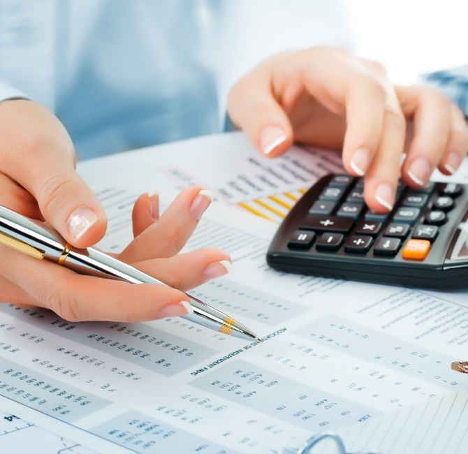 Person working on accounting calculations