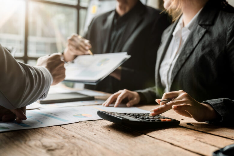 A client meets with his attorney and an accounting expert to identify examples of accounting malpractice in his records.